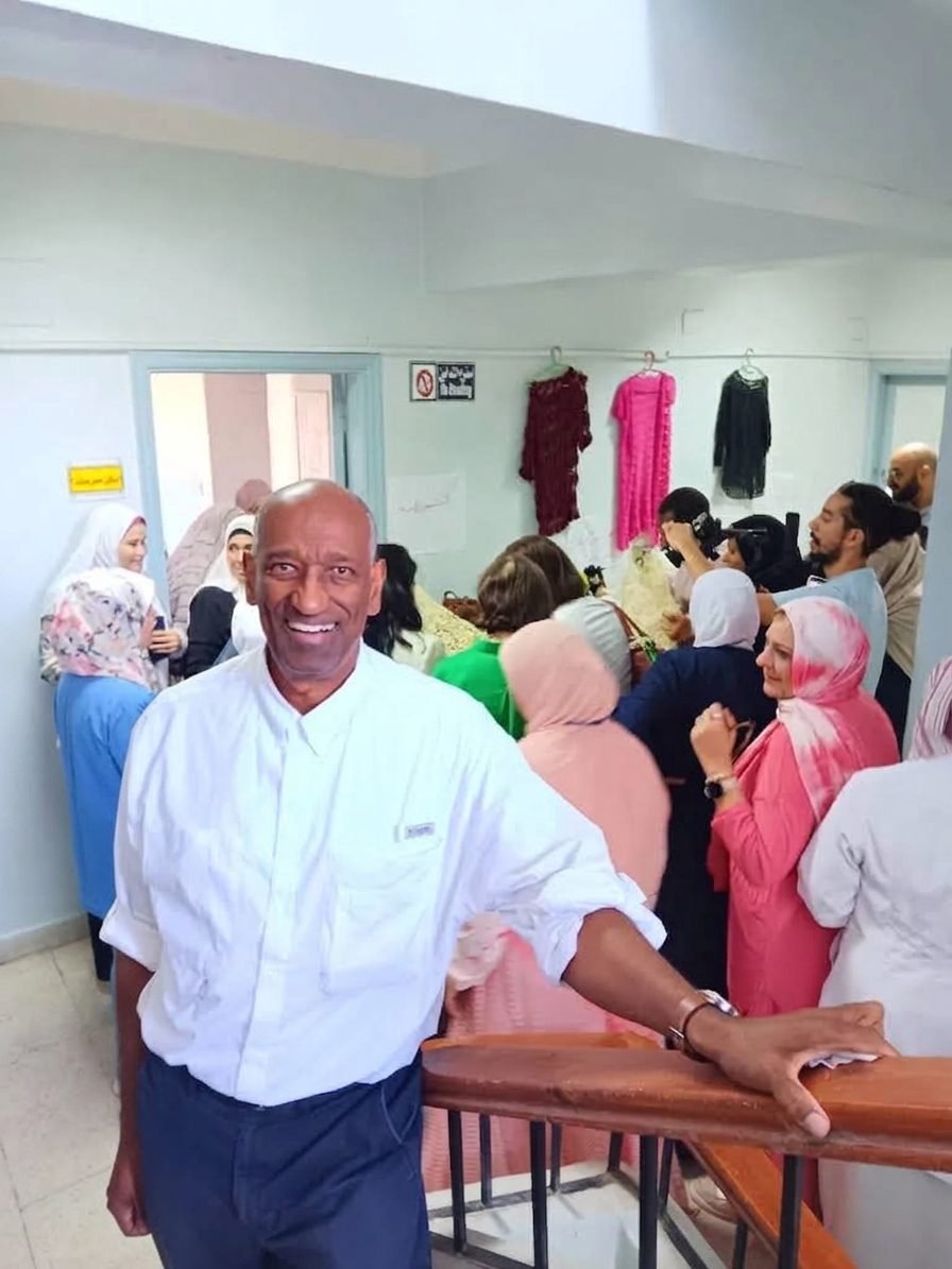 Daniel Lamaute at a clinic in Egypt, surrounded by staff and visitors